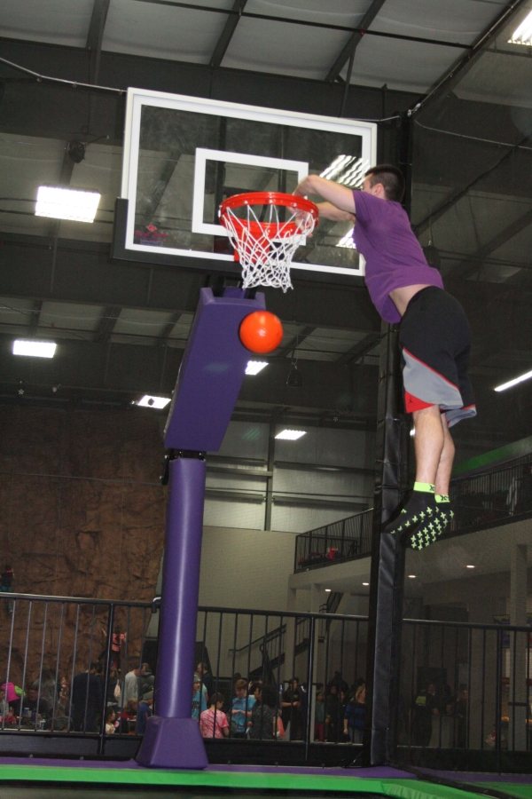 Boy Scoring a Slam Dunk